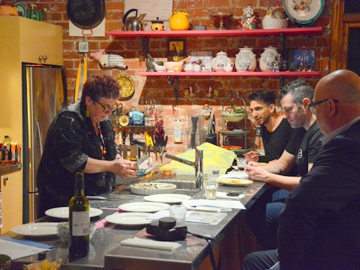 Sandra holding a class in her home kitchen (Photo credit to The Spice Adventures)